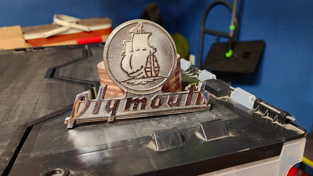 1940 PLYMOUTH TRUNK EMBLEM