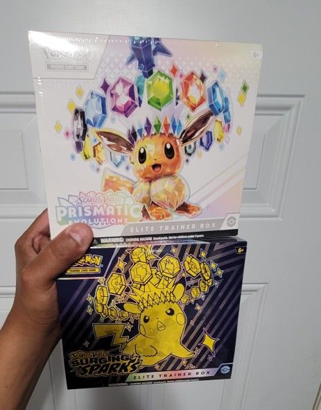 Pokemon Prismatic Evolutions ETB & Surging Sparks ETB. Lot Of Both Sealed Brand New