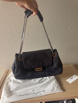 CHANEL Perforated Black Leather Shoulder Bag with Silver Chain