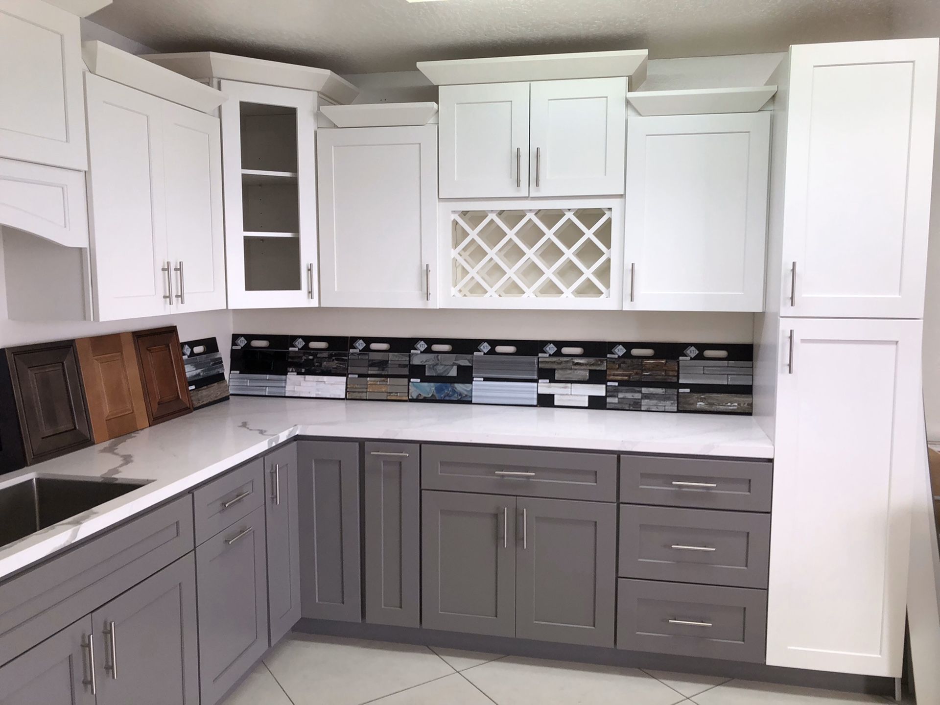 Grey and white kitchen cabinets - showroom display model