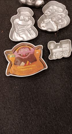 Wilton cake pans: sesame street, strawberry shortcake, etc