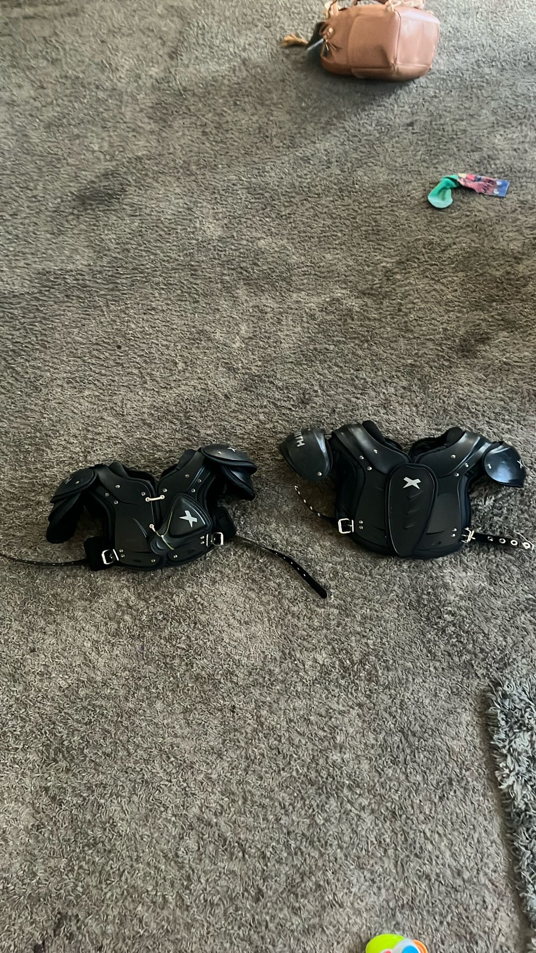 large and small shoulder football pads