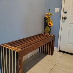 Outdoor wooden slat bench