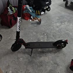 Go Trax Scooter And Fishing Poles 