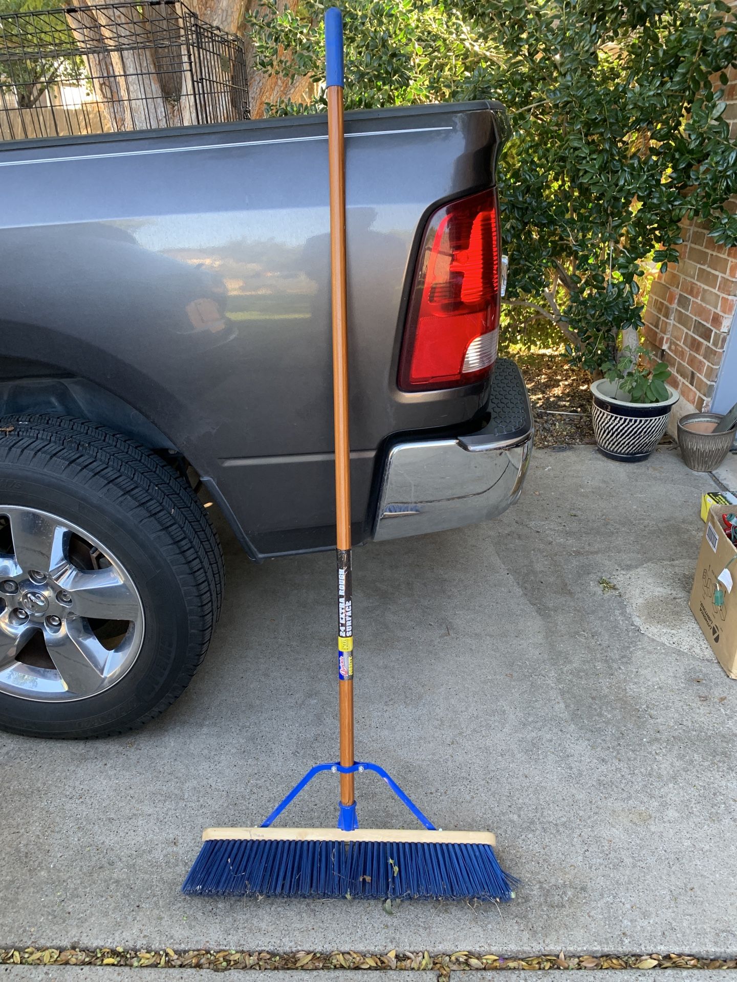 24 inch wide push broom stiff bristles like new condition