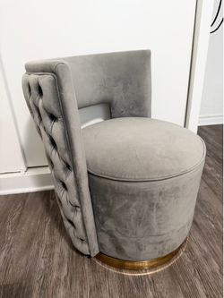 Grey tufted chair