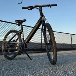 6583834 Okai Lytecycle EB60 minimalist fitness step through E bike w / up to 62 miles max operating range and 20mph max speed matte black floor model 