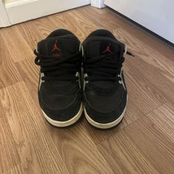 Air Jordan 4 RM men’s shoes in the black, sail, coconut milk, and gym red colorway, Size US 7