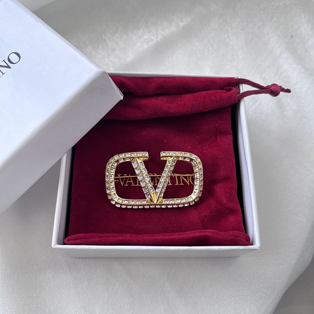 Gold Tone Logo Brooch