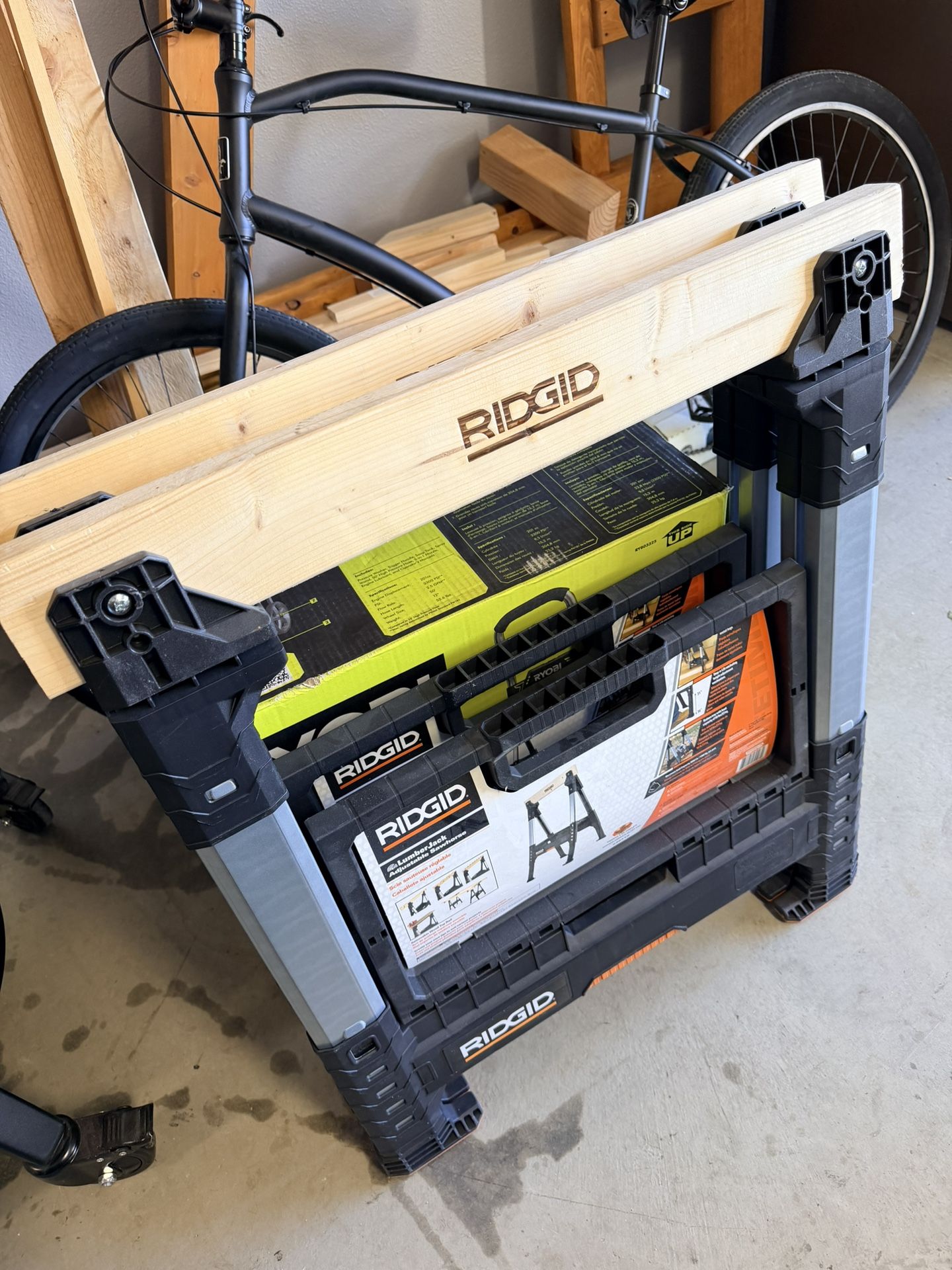 Rigid 32 in. Polypropylene Folding Sawhorse with Adjustable Heavy Duty Metal Legs, 3000 lbs. Capacity, and Under Storage Space