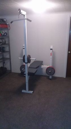 white and grey olympic size weight bench press and lat pulldown
