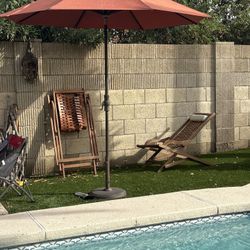 Umbrella And Wooden Recliner Chairs