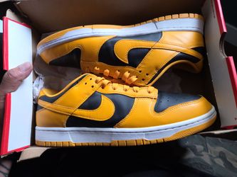 Black and yellow Nikes men's size 13