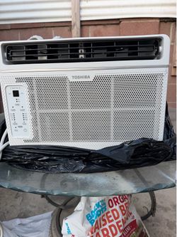 Toshiba white. Window Air Conditioner