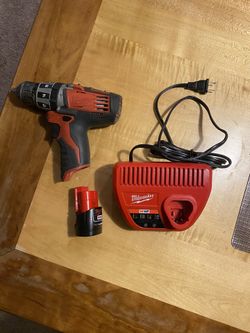 Milwaukee Hammer drill with battery and charger