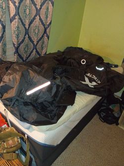 Like new motorcycle cover fit any size bikes has adjusted straps front and back front has metal holes if want to padlock onto the front wheel in perfe