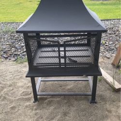 Large Fire pit With Roof And Storage! 