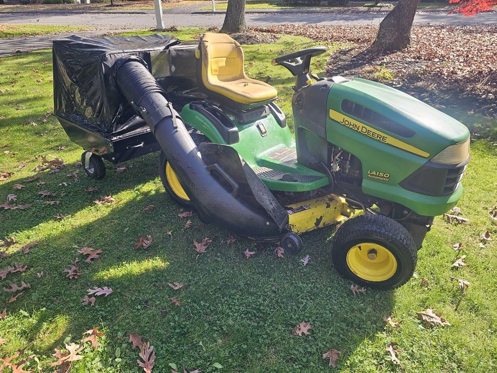 John Deere LA150 Hydrostatic 48" Cut 26HP V-Twin Riding Mower w Bagger & Plow