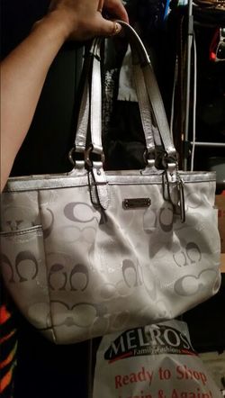 Medium size silver coach bag