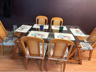 Glass top table and 6 chairs