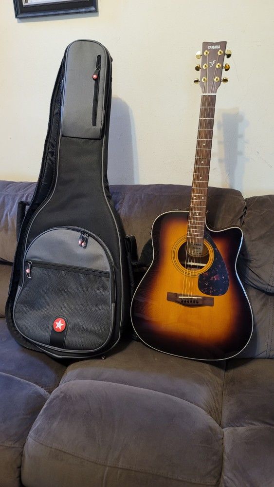 YAMAHA ACOUSTIC ELECTRIC GUITAR MODEL FX335C MADE IN INDONESIA DREINAUGH IN SUNBURST COLOR.