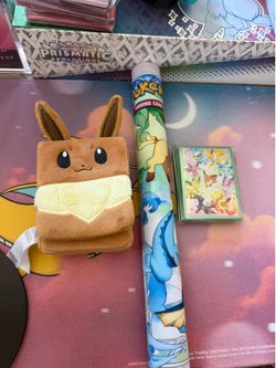 Prismatic evolutions play mat and eve deck box and card sleeves
