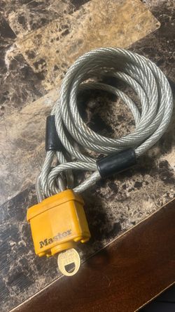 Master Lock keyed padlock yellow, weatherproof/outdoor style with a vinyl coated steel security cable