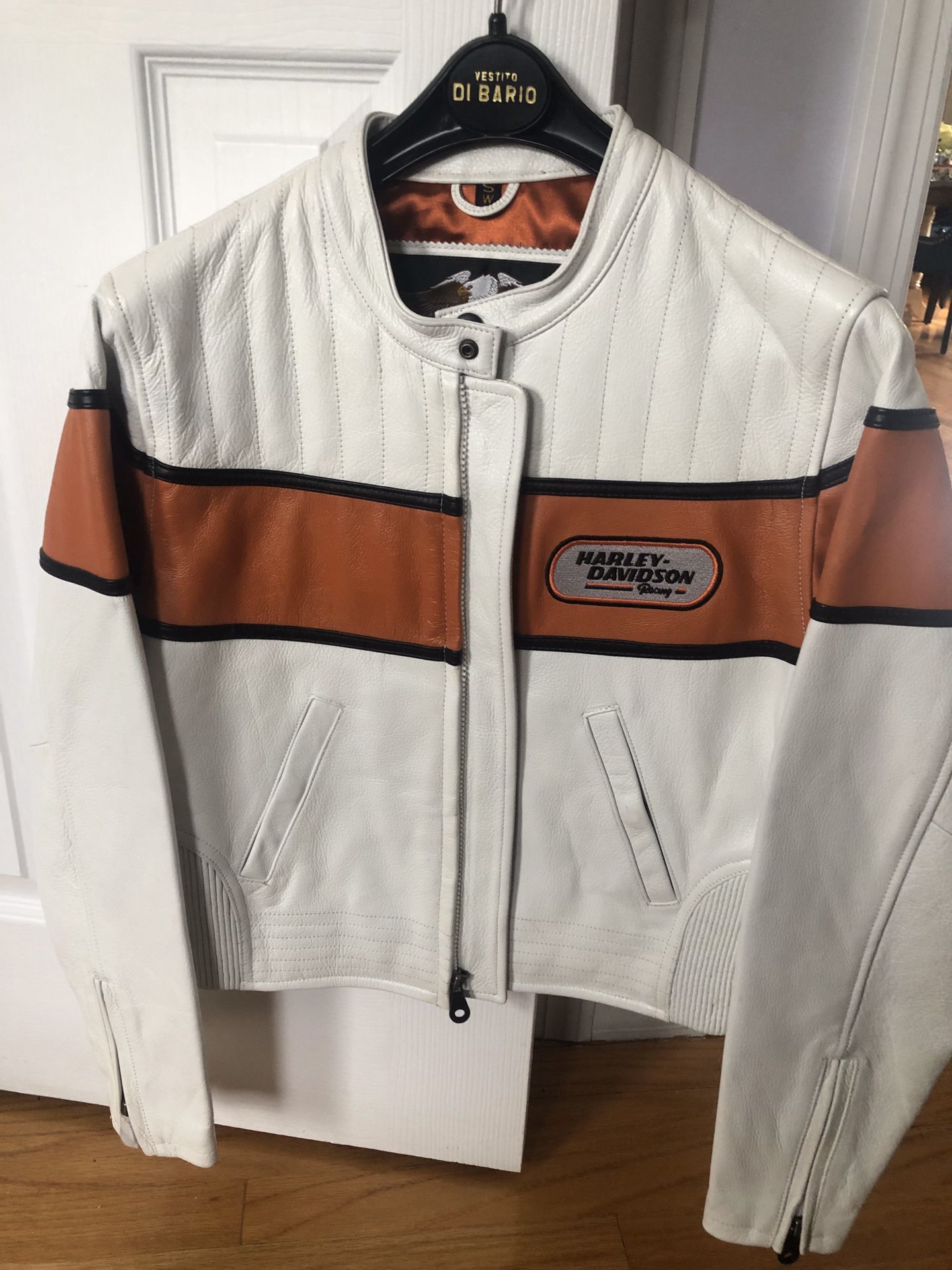 Harley Davidson women's stylish leather jacket. Size small white leather with classic orange lining. Purchased at Harley Italy in the late 90's. Neve