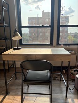 Target desk with black chair and golden lamp