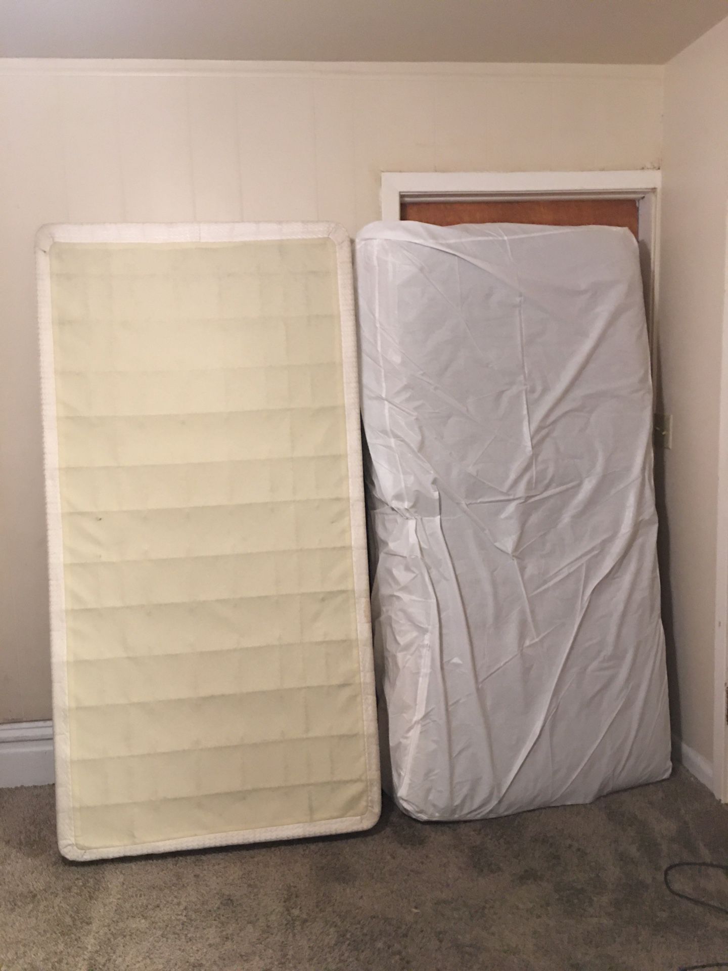 TWIN plastic covered mattress with box spring