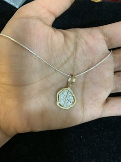 Atocha silver coin in gold bezel with silver chain