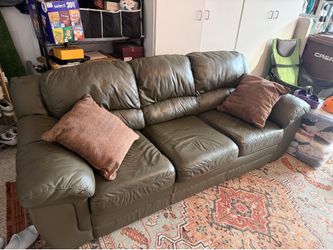 Leather Couch with pull out bed and mattress topper