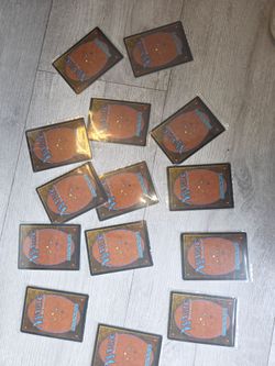 Lot of ~15–16 older Magic: The Gathering cards (sleeved)