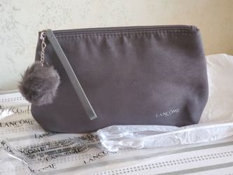 New Lancome Paris Makeup Bag Faux Suede Black With Faux Fur Pom Pom and patent wristlet strap. Condition is New in package. 10x7x2.