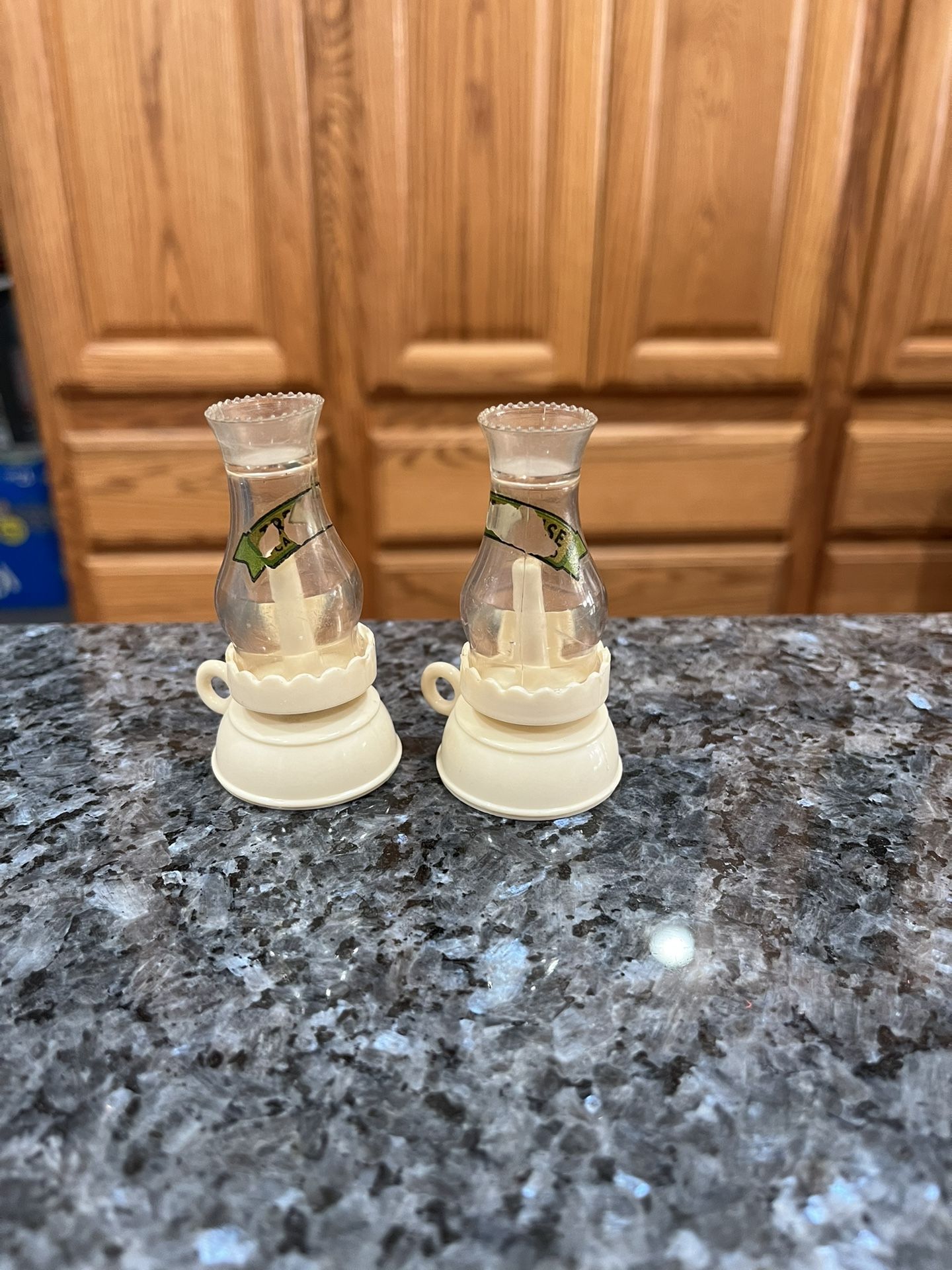 Vintage 1960's lot of 2 Miniature Hard Plastic Celluloid Oil Lamp, Lanterns. Size approximately 3 inches tall. Preowned the labels are worn. Has be