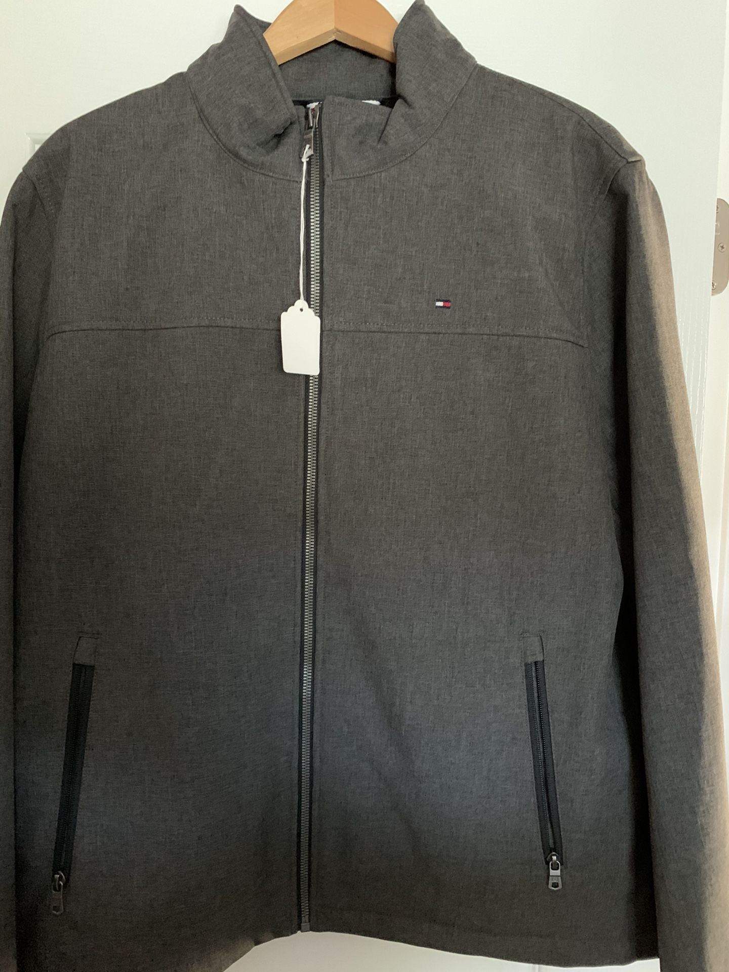 Men’s Tommy Hilfiger Brand Zippered Jacket Size Largr Dark Gray.