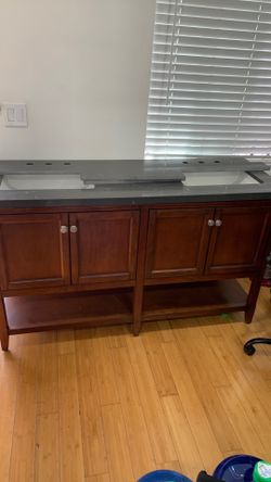 Double sink faucet cabinet