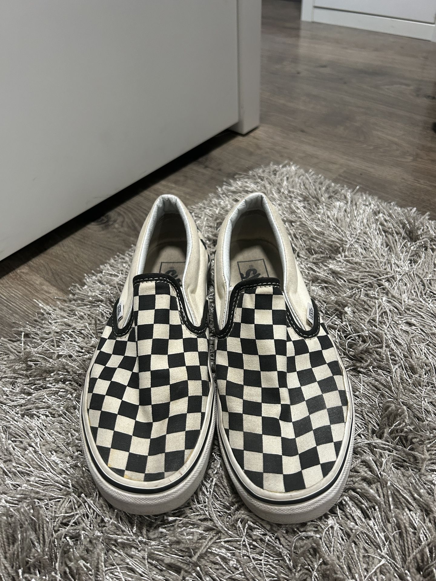 Black and white slip on vans