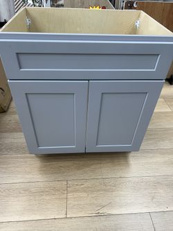 30-inch gray vanity, 30”W × 22”D × 34.5”H, solid wood construction with plywood panels, countertop not included.