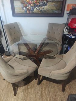 Round glass table with chairs