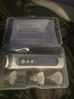 Ear pressure relief device