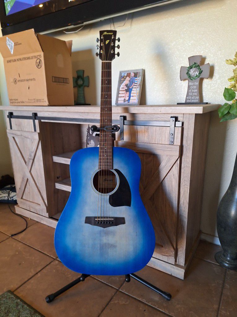 Ibanez blue sunburst acoustic guitar with stand