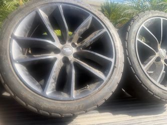 Dark gray multi-spoke alloy wheel 20”