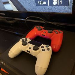 PS4 With Two Controller Idk If The Red Controller Works I Think It Need The Real PS4 Charger 