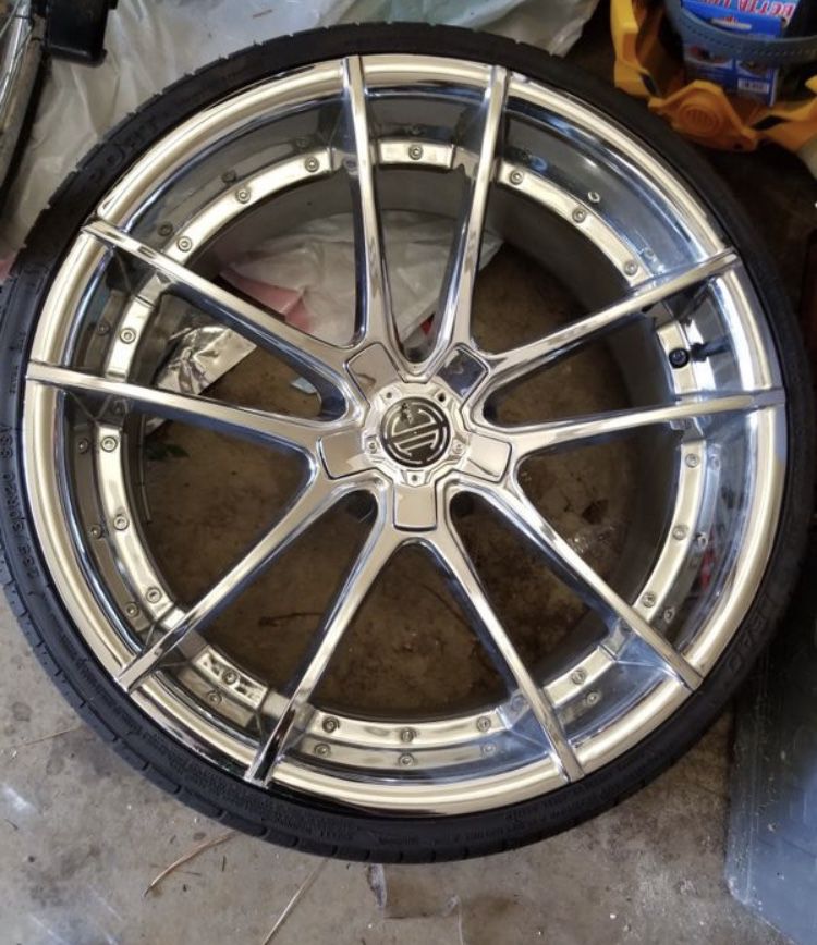 “20” inch chrome rims with four tires
