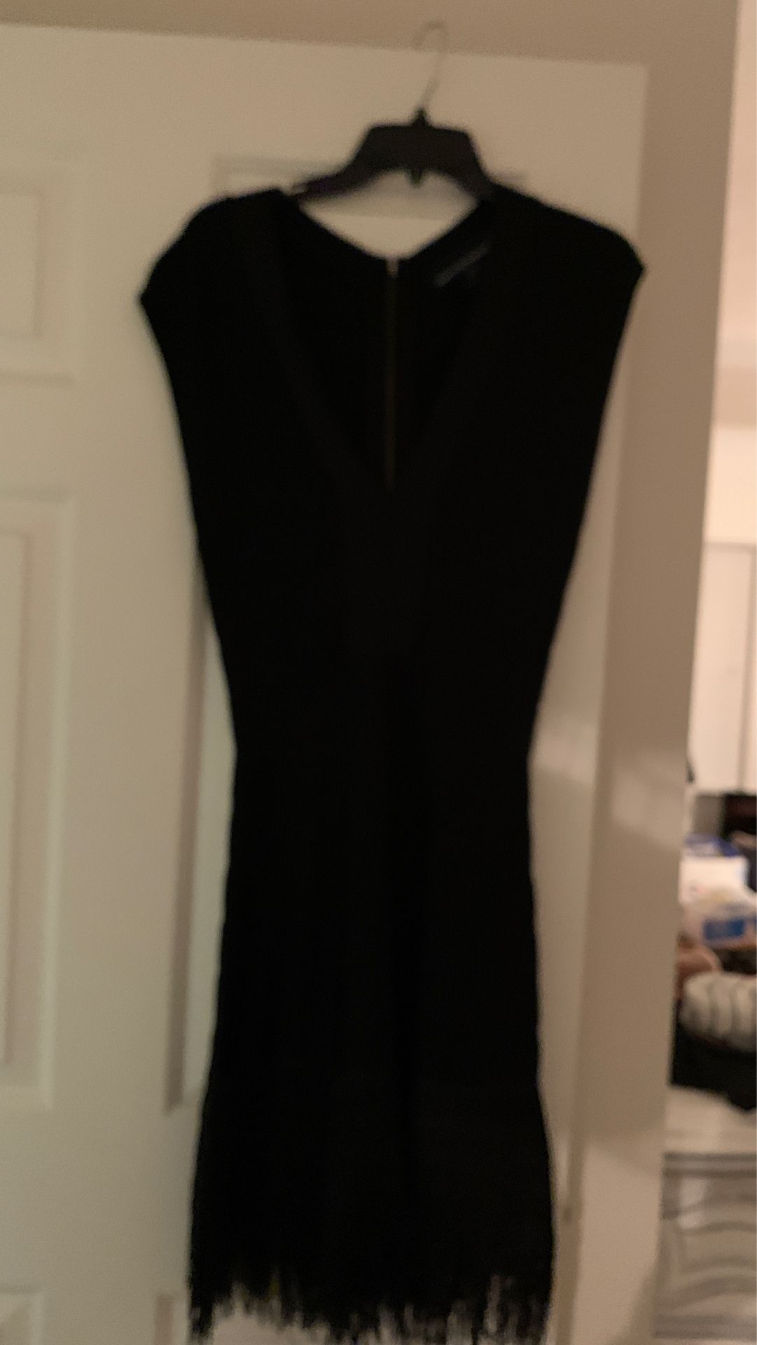 Black dress with fringes on the bottom