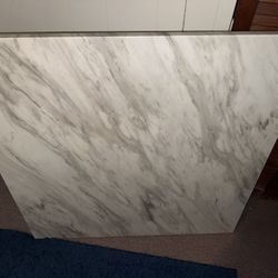 Marble tables, blue suede chairs