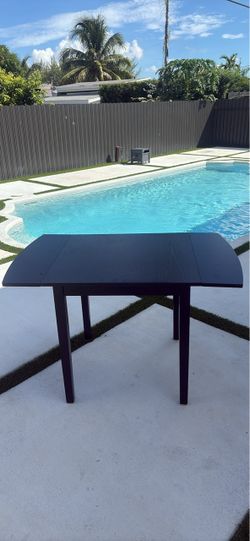 Dark wood extendable dining table