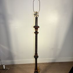 Antique carved wood or resin floor lamp base with a twisted column design and a distressed bronze finish.