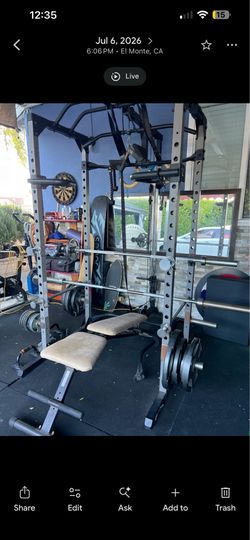 Power Rack (with pulldown) and full barbell set.